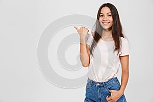 Portrait of a casual young asian woman standing