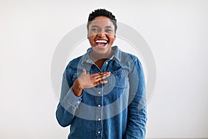 Portrait of casual young black woman laughing