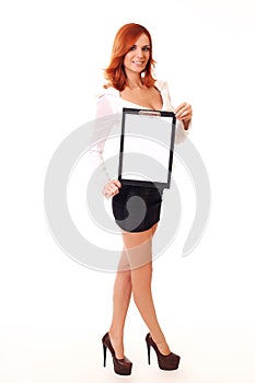Portrait of a casual young female student with clipboard over white background
