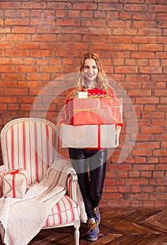 Portrait of casual young happy smiling woman hold gift box again