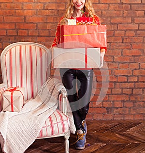 Portrait of casual young happy smiling woman hold gift box again