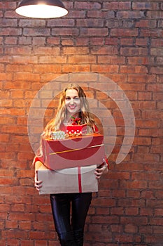 Portrait of casual young happy smiling woman hold gift box again