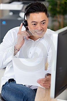 portrait casually dressed young asian office worker photo