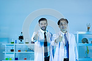 Portrait of caucasian and asian in modern scientific laboratory working together