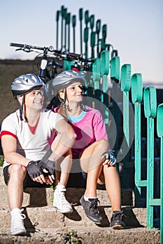 Portrait of Caucasian Bicyclists in Sport Outfit Posing With Bike