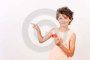 Portrait of a Caucasian boy eating watermelon on a white background-summer vacation concept