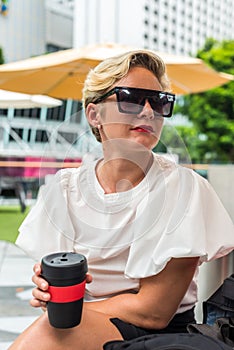 Portrait Caucasian business woman holding reusable eco-friendly cup