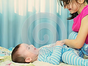 Portrait of caucasian children playing at home