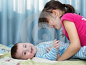 Portrait of caucasian children playing at home