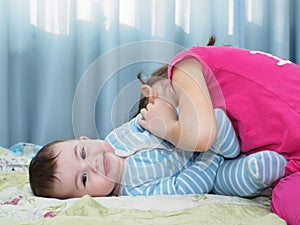 Portrait of caucasian children playing at home