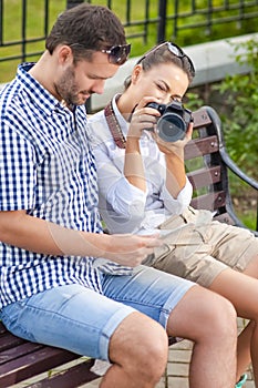 Portrait of Caucasian Couple Travelling Together with Photocamera