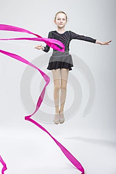 Portrait of Caucasian Female Rhythmic Gymnast In Professional Suit