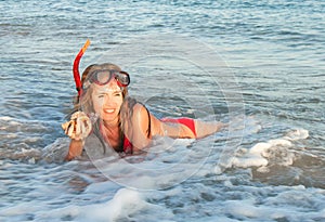 Portrait of caucasian girl at the beach with snorkeling mask.