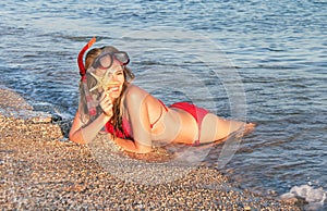 Portrait of caucasian girl at the beach with snorkeling mask.