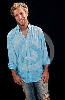 Portrait of a caucasian male smiling on black background