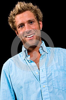 Portrait of a caucasian male smiling on black background