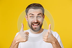 Portrait of caucasian man with big beard in white shirt. Bearded man shows thumbs up