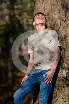 Teenage boy outside on a bright Spring day