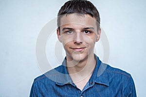 Portrait of Caucasian teenage boy on white background