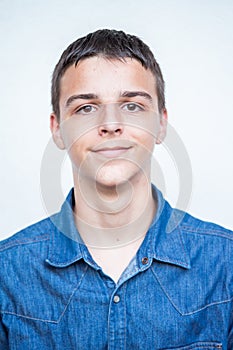 Portrait of Caucasian teenage boy on white background