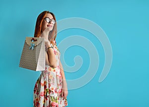 Portrait of a caucasian teenager in glasses in an white dress