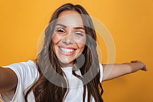 Portrait of caucasian woman 20s with long hair laughing while ta