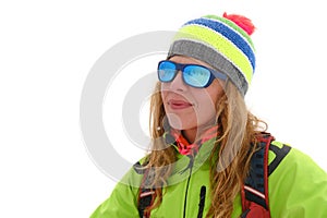 Portrait of a Caucasian woman wearing colorful Winter clothing and mirrored sunglasses, isolated on white background. Side profile