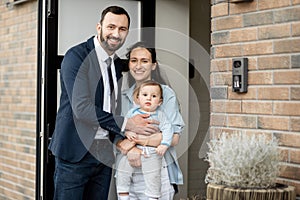 A portrait of caucasian young family with baby