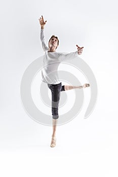 Portrait of Caucasian Young, Handsome Sporty Athletic Ballet Dancer with Lifted Hand Over White