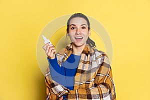 Portrait of Caucasian young woman flu and cold, feeling sick posing isolated on yellow studio background.