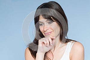 Portrait of caucasian young woman with long hair and bangs. sere