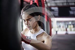 Portrait charming beautiful boxer woman: Attractive girl is practicing boxing. Gorgeous girl is punching target. Pretty girl love