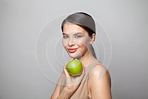 Portrait of charming beautiful healthy woman hold green apple fruit