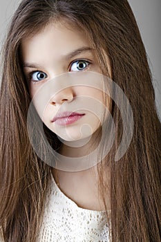 Portrait of a charming brunette little girl