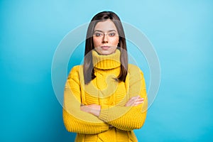 Portrait of charming content girl wearing cozy sweater folded arms isolated over vibrant blue color background