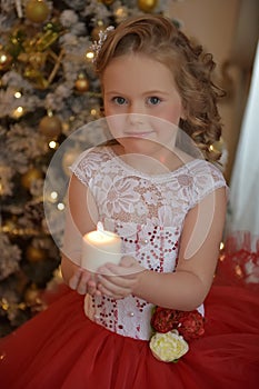 Portrait of a charming girl with candles