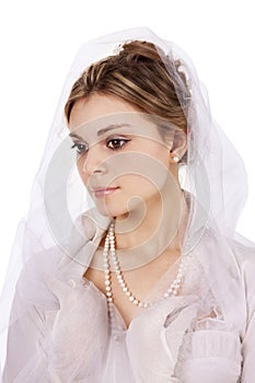 Portrait of a charming girl in a white dress in retro style, the bride in a retro dress