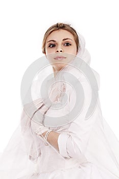 Portrait of a charming girl in a white dress in retro style, the bride in a retro dress