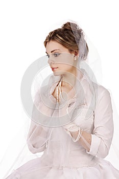 Portrait of a charming girl in a white dress in retro style, the bride in a retro dress