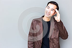 Portrait charming handsome young businessman. Attractive handsome guy is looking at copy space. Cool guy feel happy, satisfied so