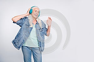 Portrait of charming lady listen soundtracks close her eyes touch electronic device isolated over white background