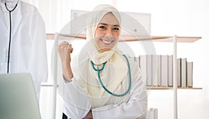 Portrait of charming muslim female doctor smiling at camera