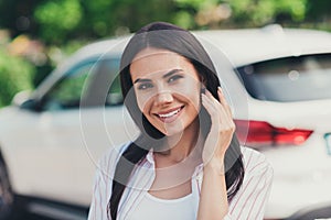 Portrait of charming nice girl car owner enjoy travel ride drive car in city center park outdoors