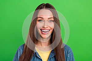 Portrait of charming positive girl toothy smile laughing good mood isolated on green color background