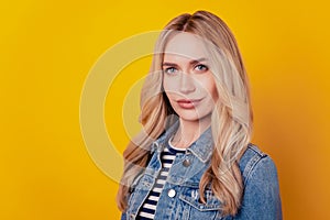 Portrait of charming pretty lovely lady posing look camera on yellow background