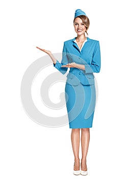 Portrait of charming stewardess wearing in blue uniform.