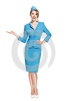 Portrait of charming stewardess wearing in blue uniform.