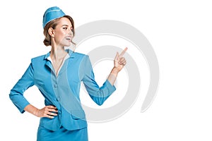 Portrait of charming stewardess wearing in blue uniform.