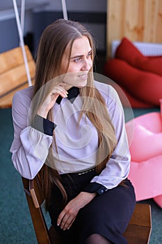 Portrait of charming young business woman looking away with smil