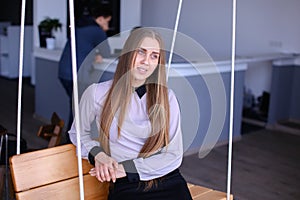 Portrait of charming young business woman looking away with smil